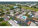 Community aerial showcasing well-maintained buildings, green spaces, parking areas and nearby amenities in the neighborhood at 24862 Us Highway 19 N # 3001, Clearwater, FL 33763