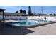 A sparkling community pool with comfortable lounge chairs around the pool area with a well-maintained fence surround at 24862 Us Highway 19 N # 3001, Clearwater, FL 33763