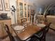 Formal dining area with a dark wood table, seating for four, and elegant decor at 24862 Us Highway 19 N # 3001, Clearwater, FL 33763