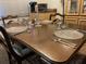 Dining room with decorative glass dishes set on a wood table for six people at 24862 Us Highway 19 N # 3001, Clearwater, FL 33763