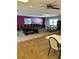 Spacious game room with a pool table, chairs, tables, and plenty of space for recreation and entertainment at 24862 Us Highway 19 N # 3001, Clearwater, FL 33763