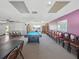 Spacious game room with a pool table, seating, and access to a library area at 24862 Us Highway 19 N # 3001, Clearwater, FL 33763