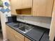 Kitchen sink with stainless steel double basin and ample counter space, in a clean and functional kitchen at 24862 Us Highway 19 N # 3001, Clearwater, FL 33763
