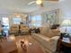 Cozy living room featuring plush seating, natural light, and comfortable furnishings at 24862 Us Highway 19 N # 3001, Clearwater, FL 33763
