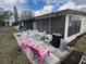 Outdoor patio area with seating, a table, and a grill, perfect for entertaining at 24862 Us Highway 19 N # 3001, Clearwater, FL 33763