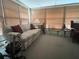 Sun room featuring a comfortable sofa, a side table, and large picture windows at 24862 Us Highway 19 N # 3001, Clearwater, FL 33763