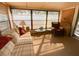 Bright sun room filled with natural light, cozy seating, and views of the outdoors at 24862 Us Highway 19 N # 3001, Clearwater, FL 33763