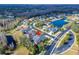Attractive home, lush trees, and street view in neighborhood close to neighborhood lake at 2903 Marble Crest Dr, Land O Lakes, FL 34638