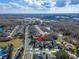 An aerial view of a home with a green lawn, mature trees, and a brick-paved driveway at 2903 Marble Crest Dr, Land O Lakes, FL 34638