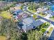 Overhead shot shows this home has screened in pool, mature landscaping, and well-kept lawn at 2903 Marble Crest Dr, Land O Lakes, FL 34638