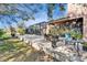 A wide view of the backyard featuring a patio, screened-in pool, and a view of the surrounding landscape at 2903 Marble Crest Dr, Land O Lakes, FL 34638
