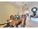 Dining room with a decorative table and chairs plus a view to the living spaces at 2903 Marble Crest Dr, Land O Lakes, FL 34638