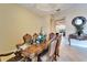 Inviting dining room featuring a decorative wood table, upholstered chairs, and elegant details throughout at 2903 Marble Crest Dr, Land O Lakes, FL 34638