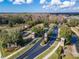 An aerial view of the community entrance surrounded by lush landscaping and green trees at 2903 Marble Crest Dr, Land O Lakes, FL 34638