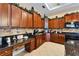 Stylish kitchen featuring stainless steel appliances, granite countertops, and custom cabinetry at 2903 Marble Crest Dr, Land O Lakes, FL 34638