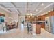 Open kitchen with granite countertops, stainless steel appliances, breakfast bar, and tile flooring at 2903 Marble Crest Dr, Land O Lakes, FL 34638
