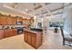 Spacious kitchen with granite countertops, wood cabinets, stainless steel appliances, and a large island at 2903 Marble Crest Dr, Land O Lakes, FL 34638