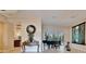 Bright living area with tile flooring, a grand piano, and seamless access to the inviting outdoor living space at 2903 Marble Crest Dr, Land O Lakes, FL 34638