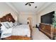 This main bedroom offers a tray ceiling and access to the ensuite bathroom and walk-in closet at 2903 Marble Crest Dr, Land O Lakes, FL 34638