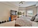 Relaxing main bedroom featuring a tray ceiling, pool access, and comfortable furnishings at 2903 Marble Crest Dr, Land O Lakes, FL 34638