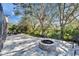 Outdoor patio with a cozy brick fire pit, perfect for entertaining or enjoying peaceful evenings at 2903 Marble Crest Dr, Land O Lakes, FL 34638