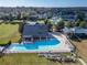 A large pool with lounge chairs are visible at this community clubhouse at 2903 Marble Crest Dr, Land O Lakes, FL 34638