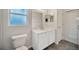 Well-lit bathroom has a clean, minimalist design with modern fixtures and finishes at 3339 Brenford Pl, Land O Lakes, FL 34638