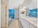 Bright bathroom showcasing dual sinks, shower, and soaking tub at 3339 Brenford Pl, Land O Lakes, FL 34638