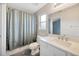 This bathroom is well lit and has a large shower-tub combo at 3339 Brenford Pl, Land O Lakes, FL 34638
