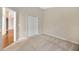 Cozy bedroom with neutral carpet, paint, and closet at 3339 Brenford Pl, Land O Lakes, FL 34638