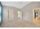 Comfortable bedroom with a ceiling fan and ensuite bathroom, offering peace and privacy at 3339 Brenford Pl, Land O Lakes, FL 34638