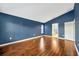 Cozy bedroom with hardwood floors and large windows at 3339 Brenford Pl, Land O Lakes, FL 34638