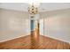 Dining room with hardwood floors and attractive chandelier lighting at 3339 Brenford Pl, Land O Lakes, FL 34638