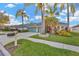 Charming home featuring a well-manicured lawn, mature landscaping, and a three-car garage at 3339 Brenford Pl, Land O Lakes, FL 34638