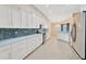 Spacious kitchen boasts stainless steel appliances and ample counter space at 3339 Brenford Pl, Land O Lakes, FL 34638
