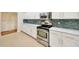 Modern kitchen features stainless steel oven and emerald backsplash at 3339 Brenford Pl, Land O Lakes, FL 34638