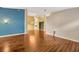 Expansive living room with glossy hardwood floors and neutral paint at 3339 Brenford Pl, Land O Lakes, FL 34638