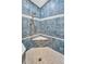 Tiled shower with built-in bench and shower head at 3339 Brenford Pl, Land O Lakes, FL 34638