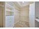 Walk-in closet with custom organizers and ample shelving space at 3339 Brenford Pl, Land O Lakes, FL 34638