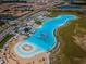 Southshore Bay community lagoon with beach, lounge area, and an inflatable obstacle course at 5316 Stoic Vale Dr, Wimauma, FL 33598
