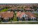 Extensive aerial view of a residential community with uniform tile roofs and green landscaping at 5316 Stoic Vale Dr, Wimauma, FL 33598