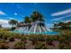 The Southshore Bay community fountain's many spouts of water is surrounded by landscaping at 5316 Stoic Vale Dr, Wimauma, FL 33598