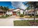 Charming single-story home with a tile roof, two-car garage, and manicured landscaping at 5316 Stoic Vale Dr, Wimauma, FL 33598