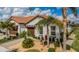 Beautiful home featuring a tile roof, two-car garage, and well-maintained landscaping at 5316 Stoic Vale Dr, Wimauma, FL 33598