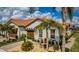 Beautiful single Gathering home exterior featuring a tile roof and manicured landscaping at 5316 Stoic Vale Dr, Wimauma, FL 33598