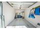 Clean and organized two car garage with epoxy floor and ample storage space at 5316 Stoic Vale Dr, Wimauma, FL 33598