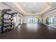 Well-equipped gym with modern equipment, mirrors, and ample space for workouts at 5316 Stoic Vale Dr, Wimauma, FL 33598
