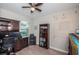 Functional home office with built-in desk, ample shelving, and natural light creates a productive workspace at 5316 Stoic Vale Dr, Wimauma, FL 33598