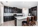 Updated kitchen featuring stainless steel appliances, elegant cabinetry, and a functional island with seating at 5316 Stoic Vale Dr, Wimauma, FL 33598