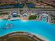 The Southshore Bay lagoon features an inflatable obstacle course, beach, cabanas and lounge area at 5316 Stoic Vale Dr, Wimauma, FL 33598